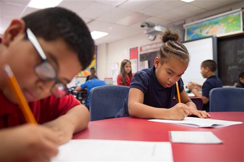 Students writing in class 