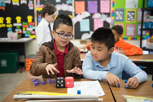 Students playing game in classroom 