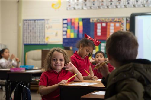 Student smiling in classroom 