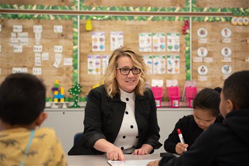 Dr. Murray with students in classroom